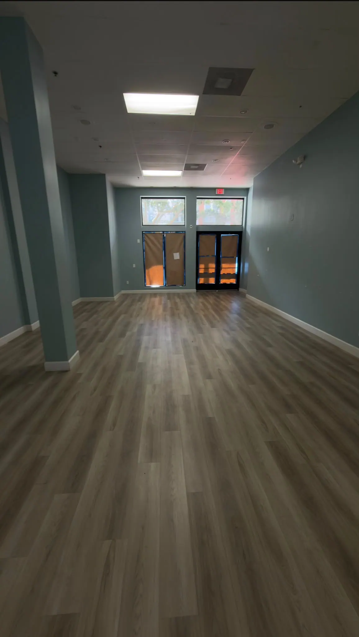 Finished commercial space by M&S Construction, with new floor and closed ceiling